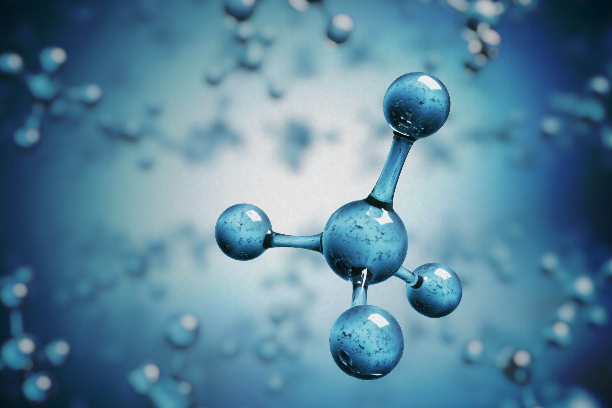 Ein großes blaues Bioethanolmolekül schwebt frei zwischen vielen kleinen Molekülen